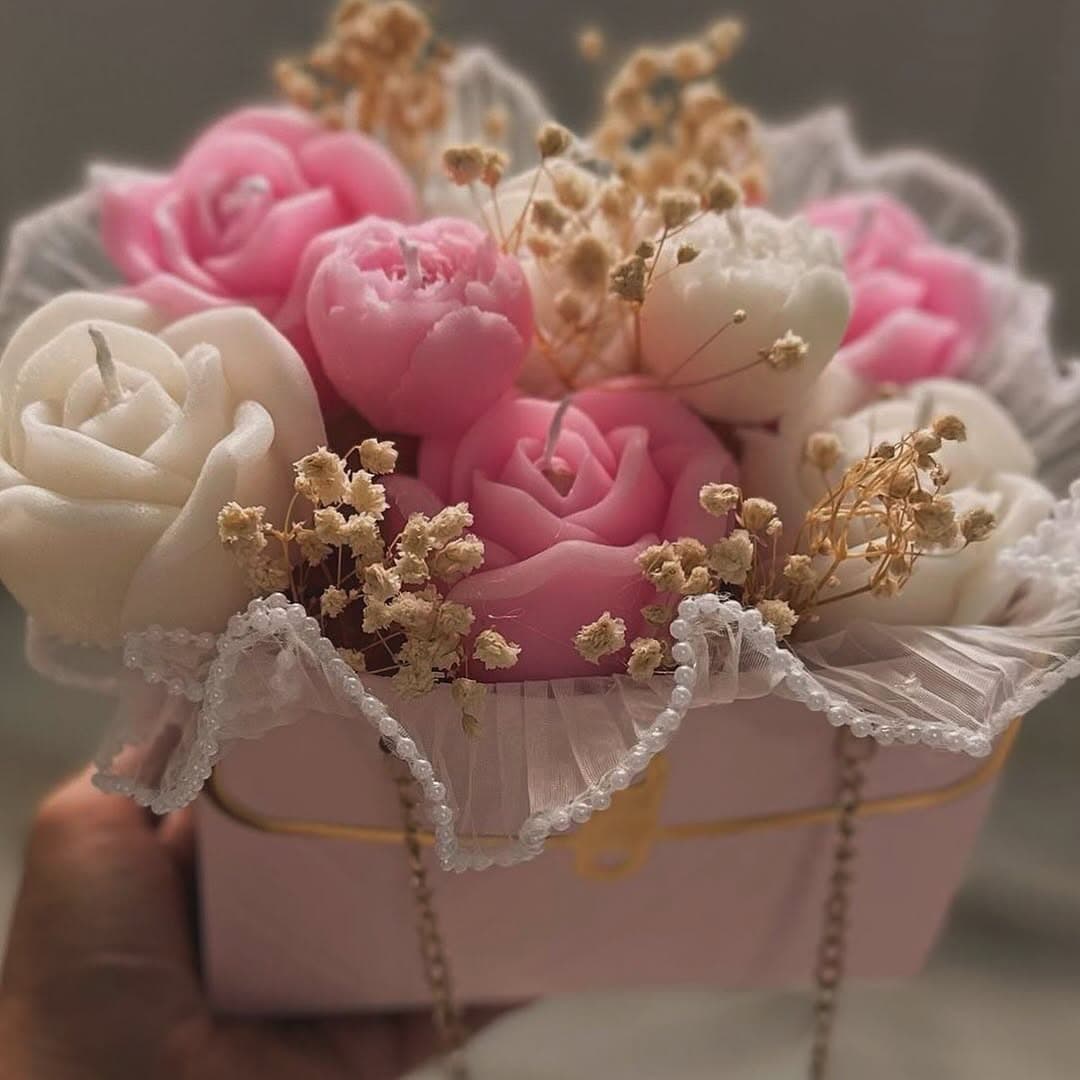 Our handmade candle bouquet in soft pink & white, featuring chocolate and sweet 